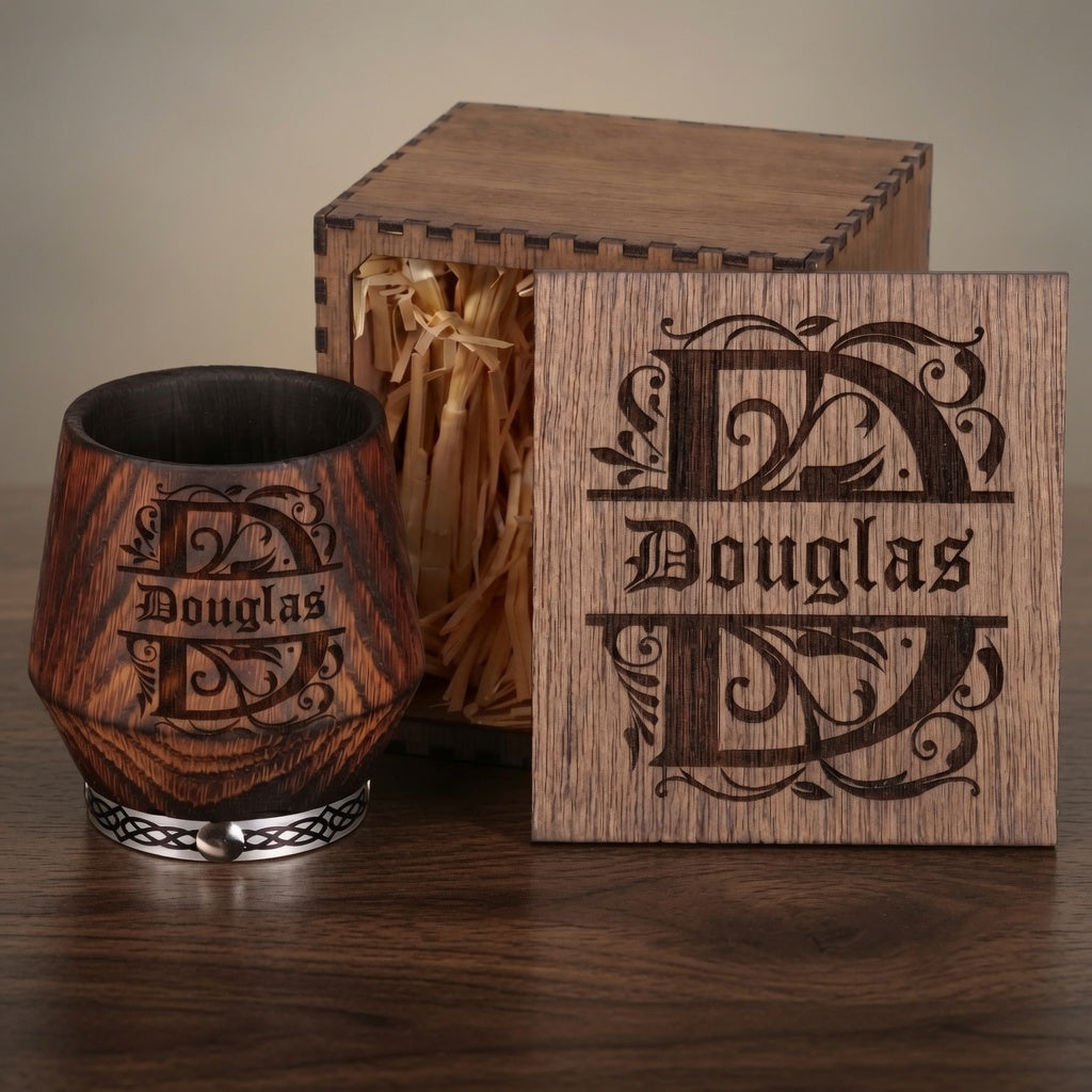 Personalized charred oak whiskey glass with an engraved wooden gift box and natural straw filler.