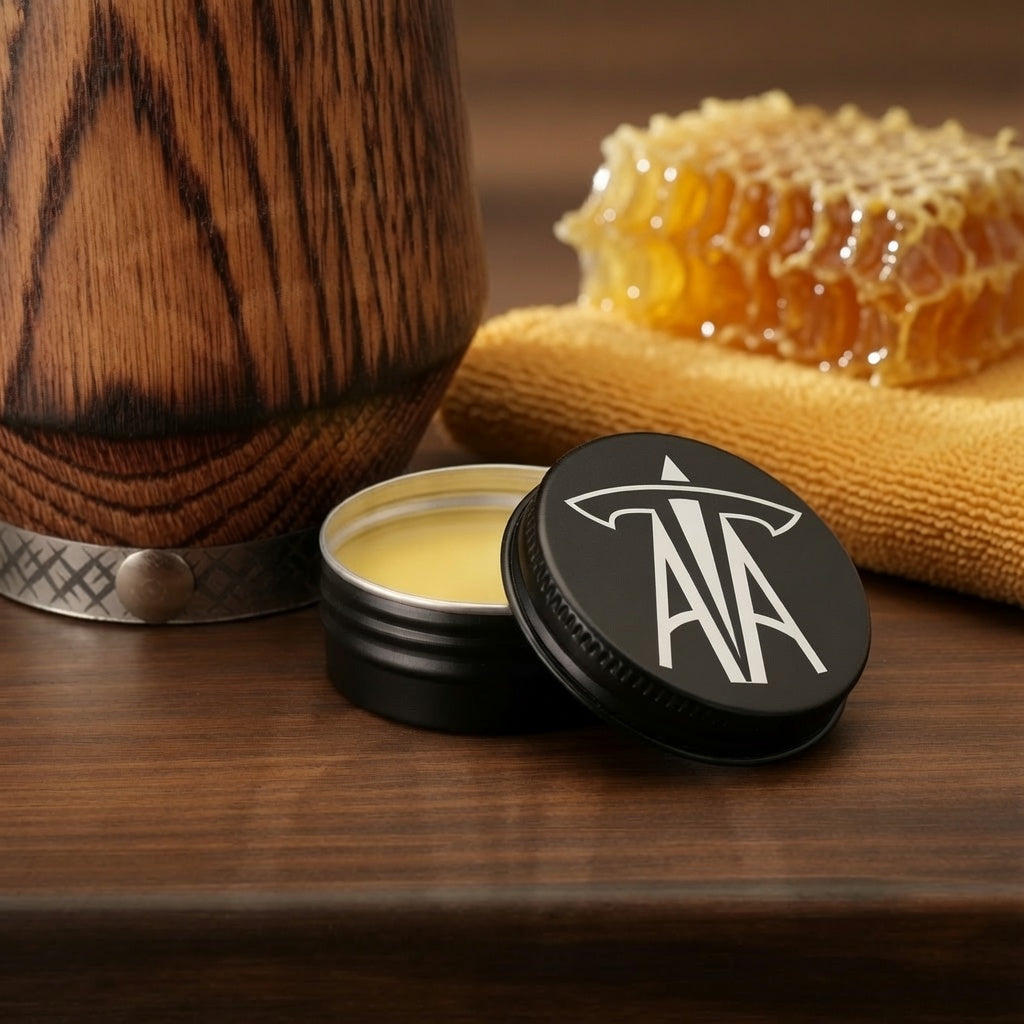 Beeswax and plant-based oil care balm included with the charred oak whiskey glass gift set.