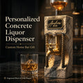 Personalized concrete liquor dispenser with black and gold engraved plaque, brass tap, and industrial home bar style