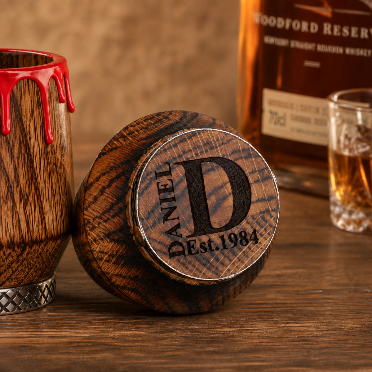 Custom monogram and date laser engraving on the bottom of an oak whiskey glass