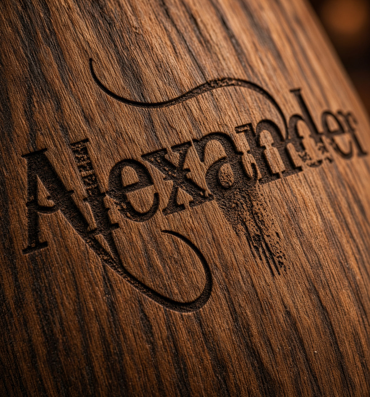 Close-up of permanent Alexander laser engraving on natural oak whiskey glass