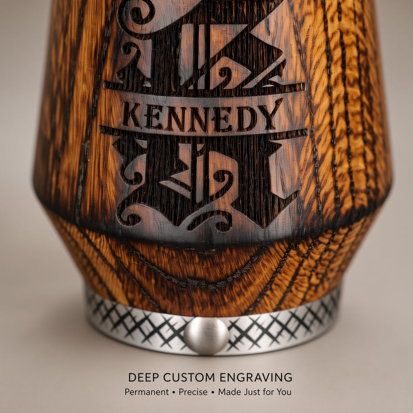 Close-up of deep laser engraving on personalized solid oak whiskey glass