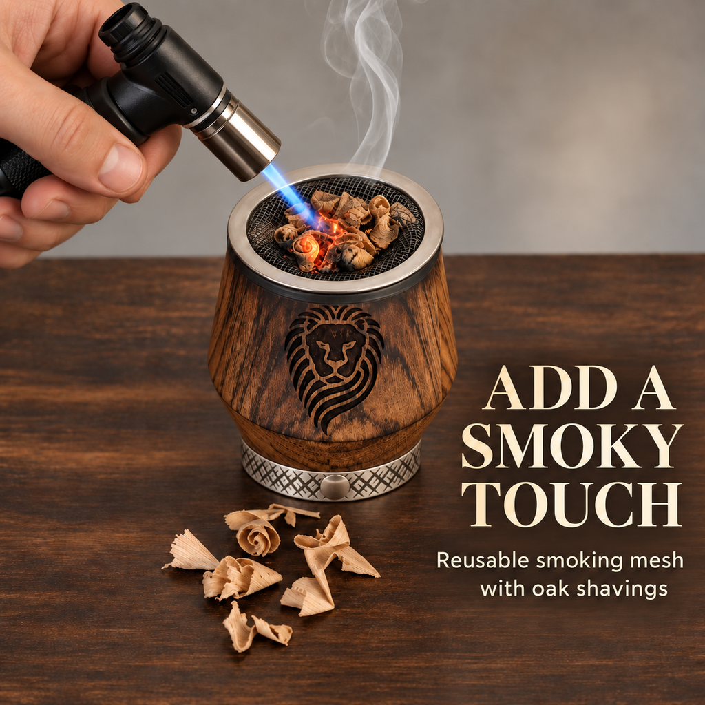 Charred oak whiskey tumbler with a reusable mesh holding smoking wood shavings, a handheld torch, and the words Add a Smoky Touch