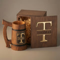 Personalized oak beer mug with a black and gold name plaque, epoxy inlay wooden box lid, and straw-filled gift box.