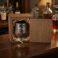 Personalized charred oak whiskey glass displayed inside a wooden presentation box with natural straw filler.