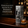 Personalized silver slate whiskey dispenser with custom monogram plaque and glass on home bar.
