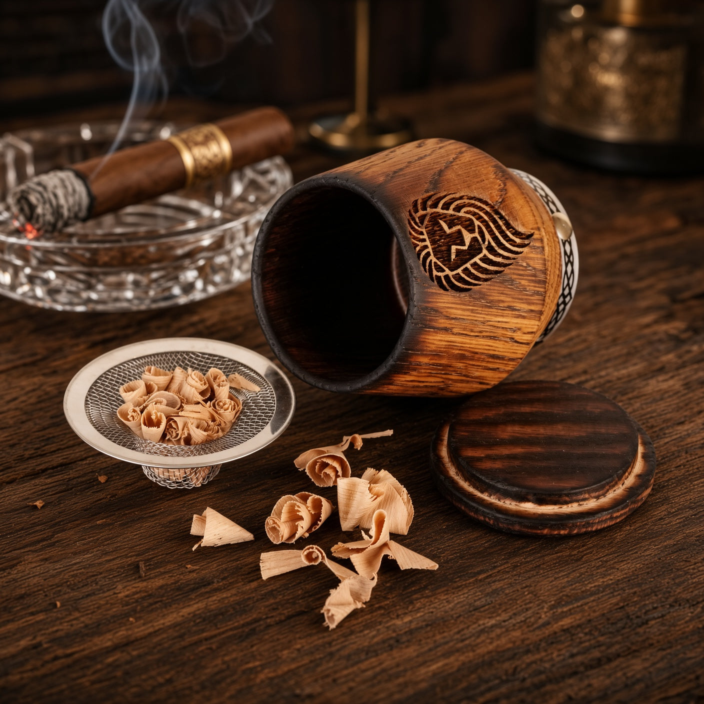 Personalized charred oak whiskey smoker glass with lion engraving, oak lid, smoking chips and warm bar setting.