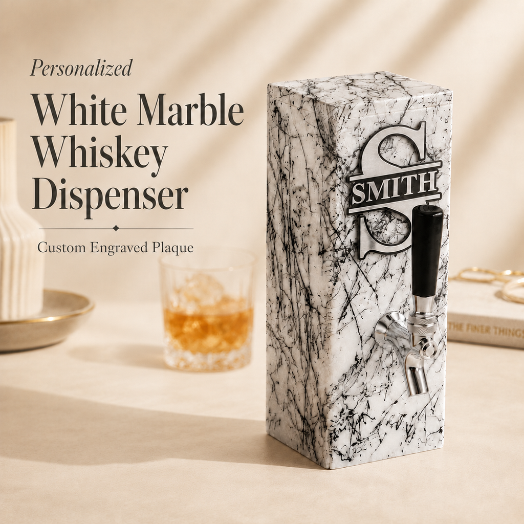 Personalized white marble whiskey dispenser with engraved aluminum plaque and silver-tone tap, styled with a whiskey glass for a custom bar gift.