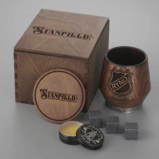 Personalized oak whiskey tumbler displayed with wooden gift box, coaster and whiskey stones