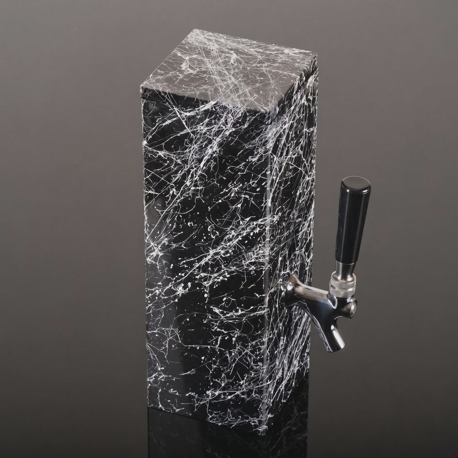 Black granite beverage dispenser product view showing white splatter finish and metal tap