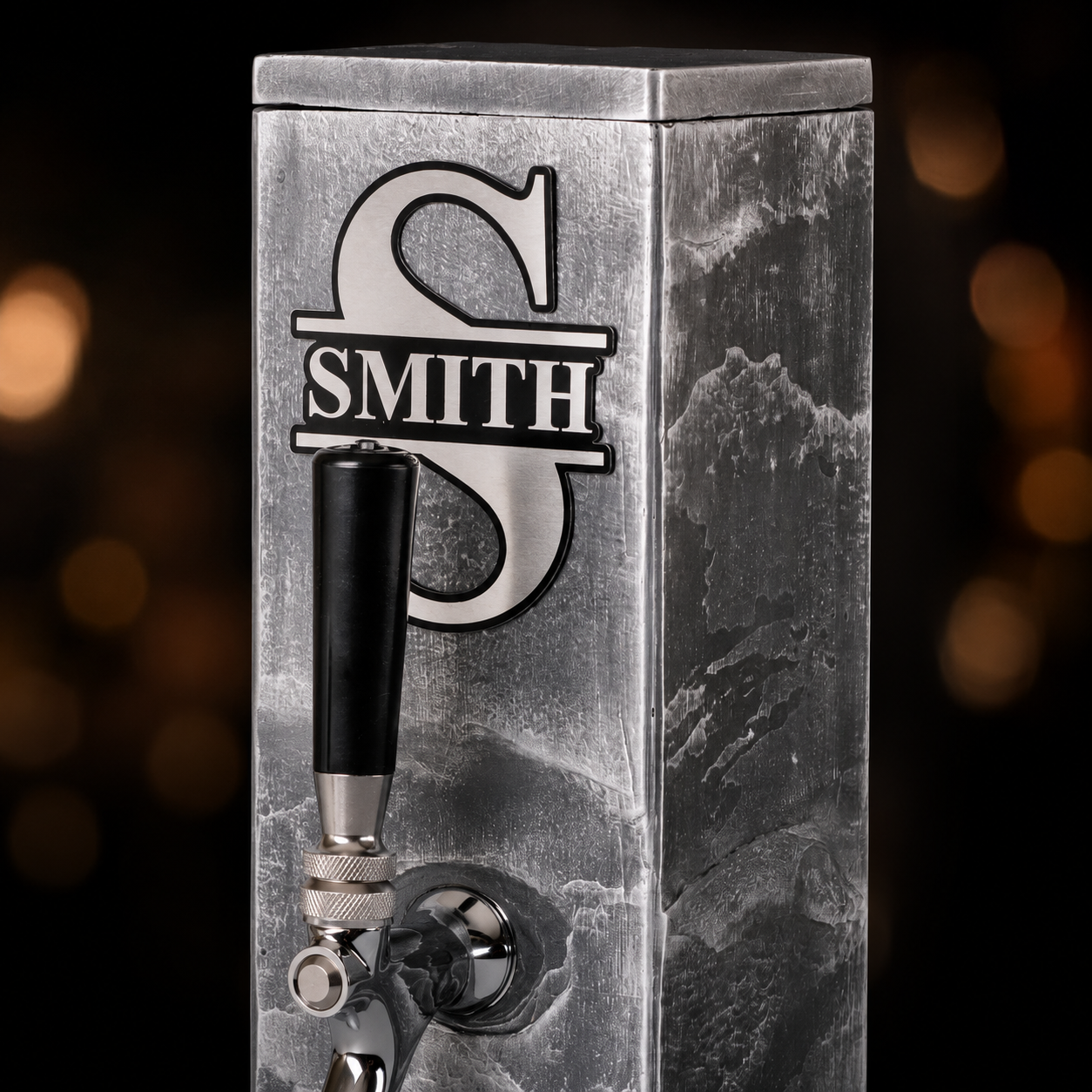 Front detail of silver slate whiskey dispenser with custom engraved monogram plaque.